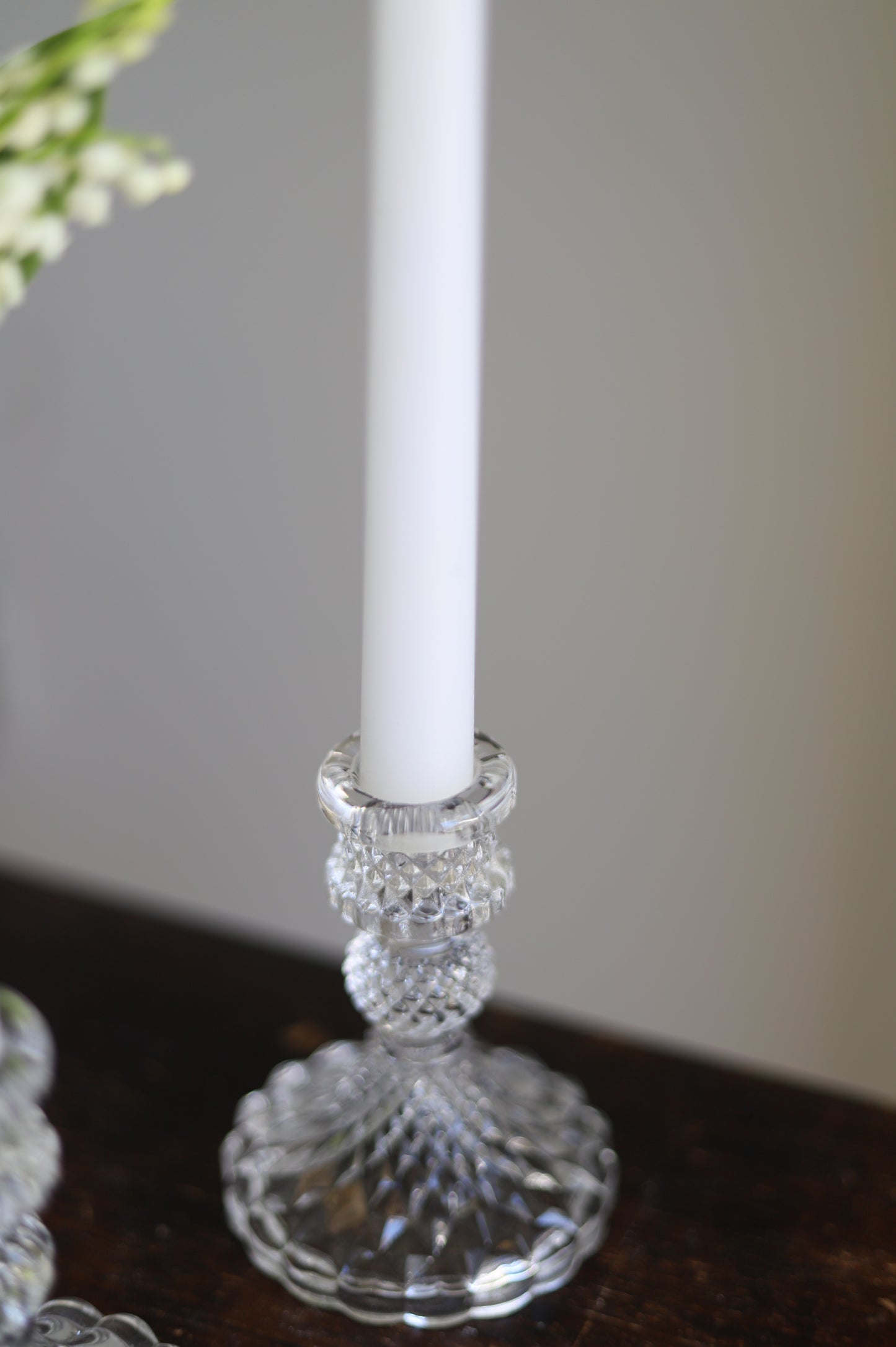 White taper candle + clear holder
