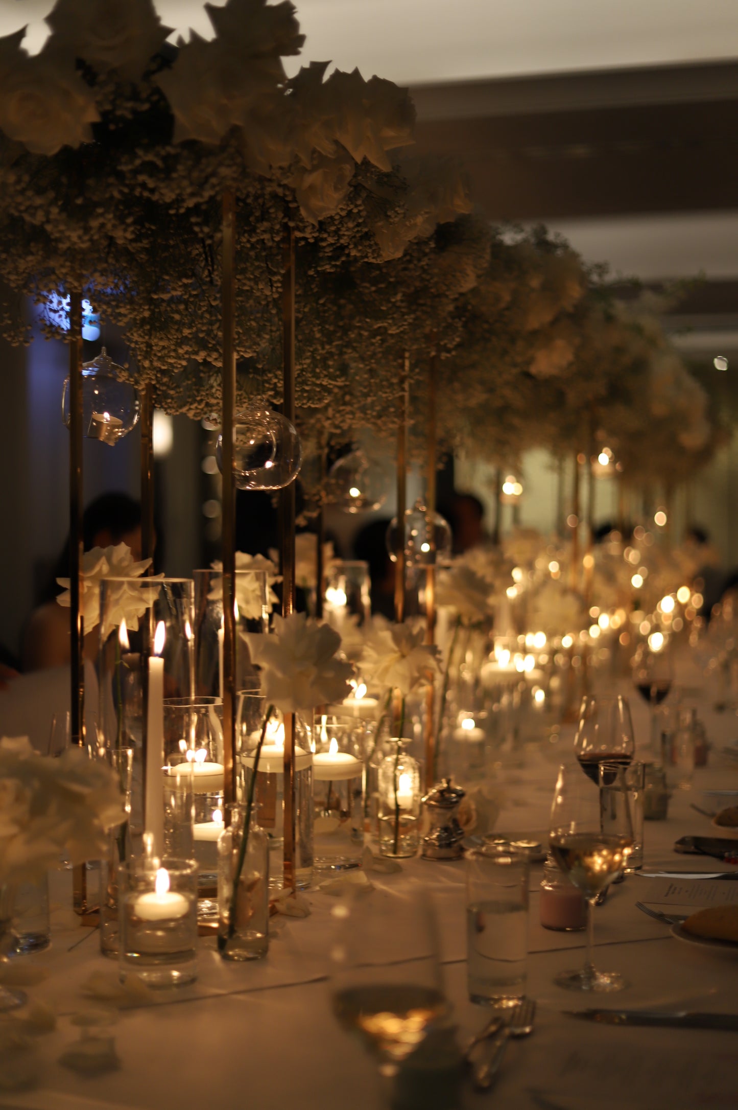 Taper candles in cylinder vase