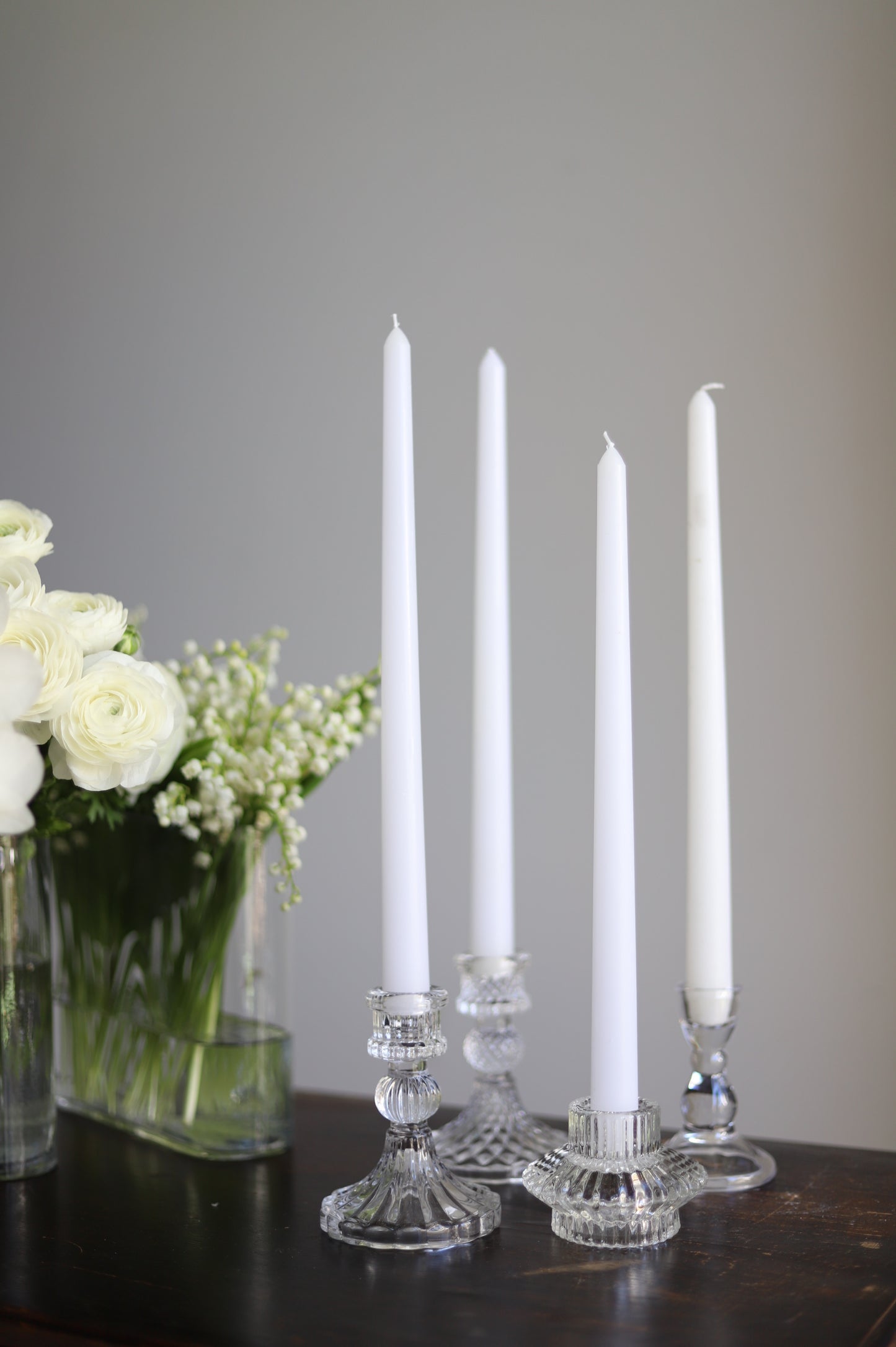 White taper candle + clear holder
