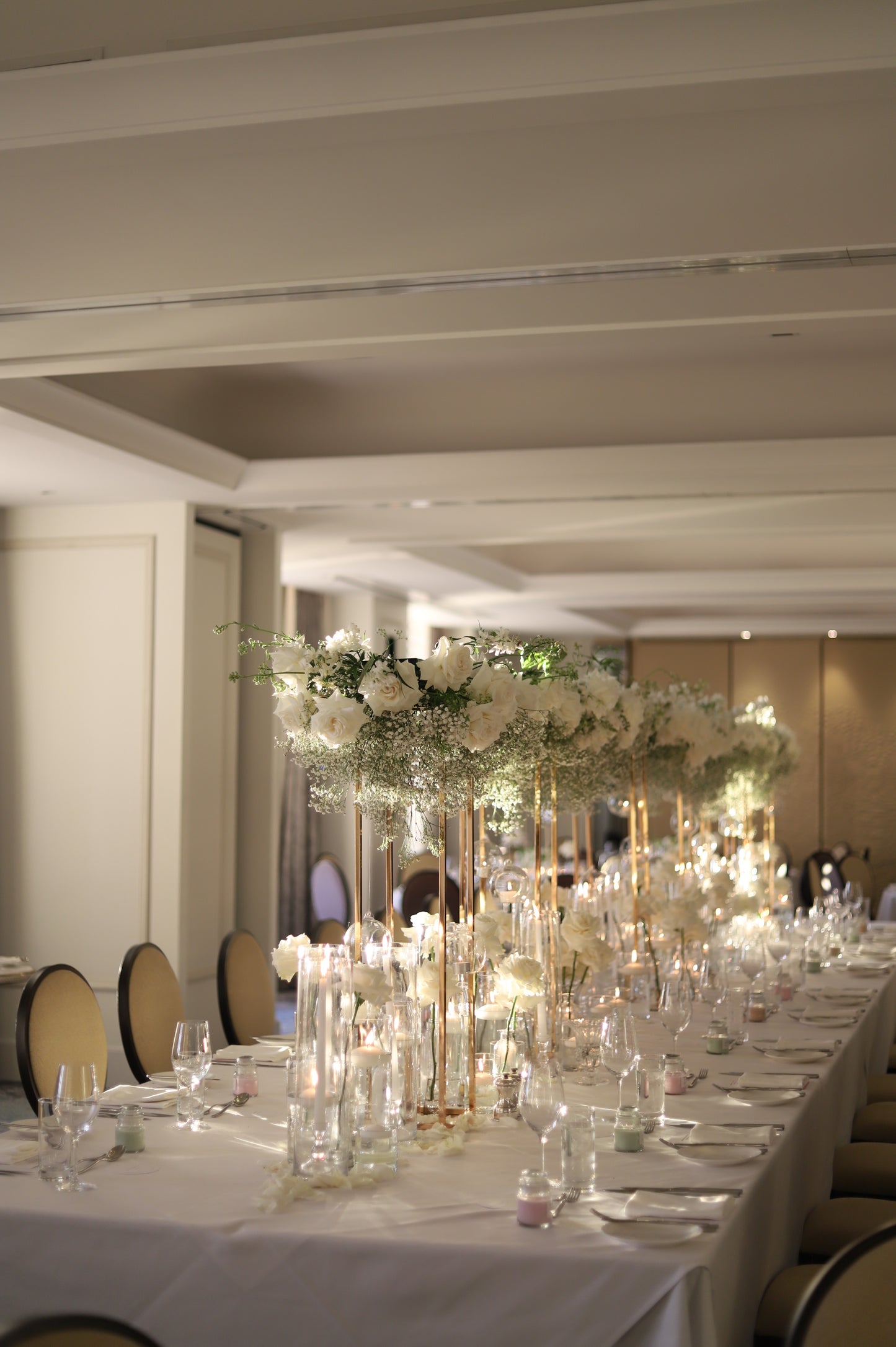 Taper candles in cylinder vase