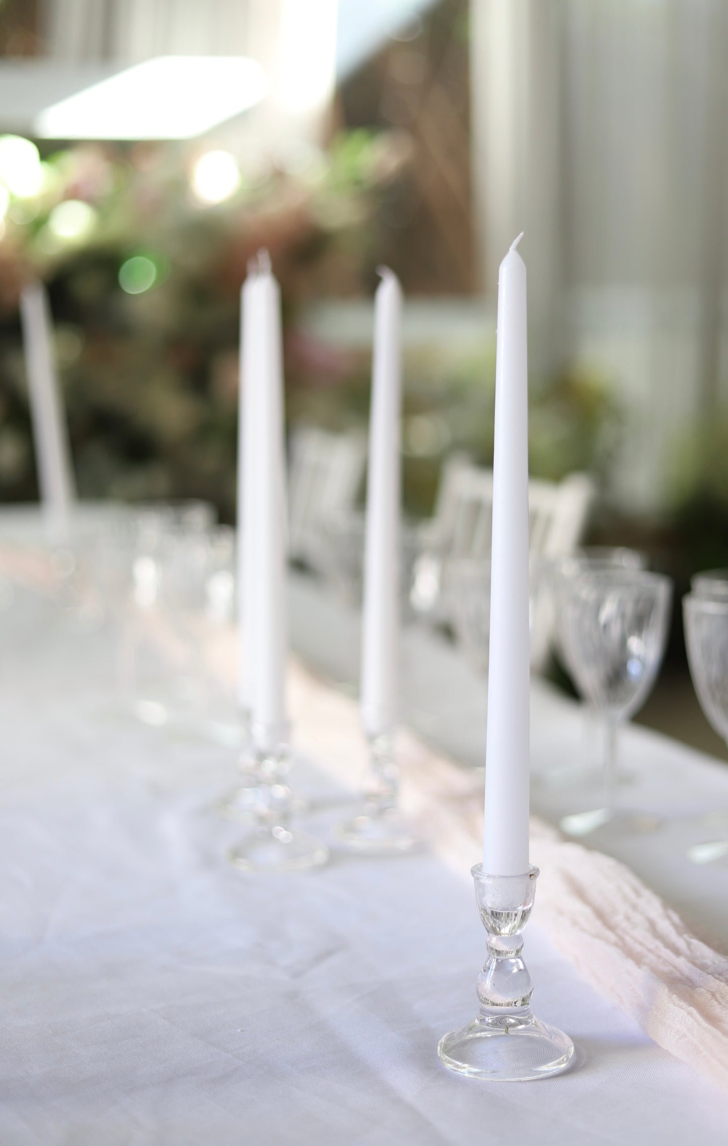 White taper candle + clear holder