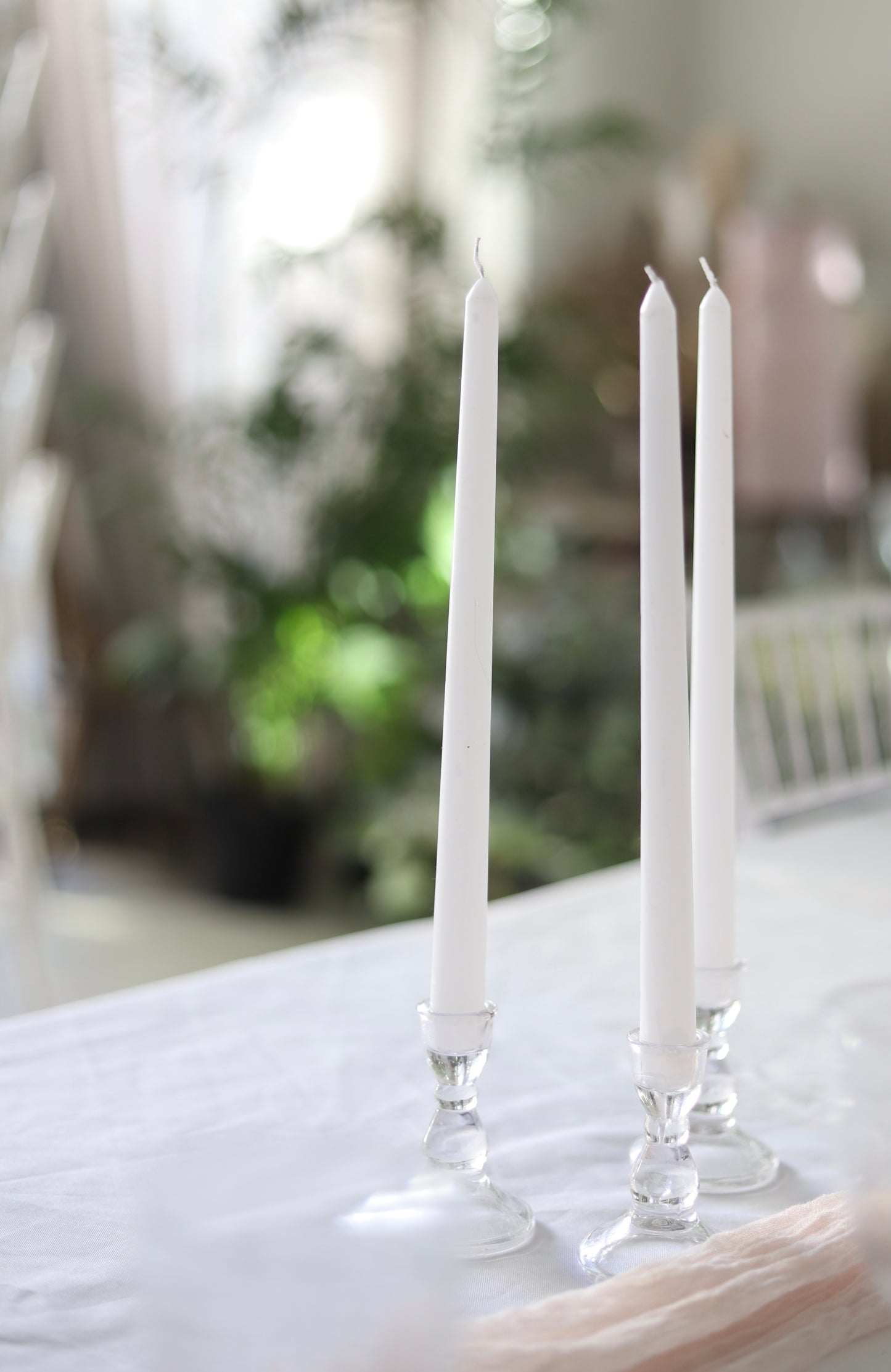 White taper candle + clear holder