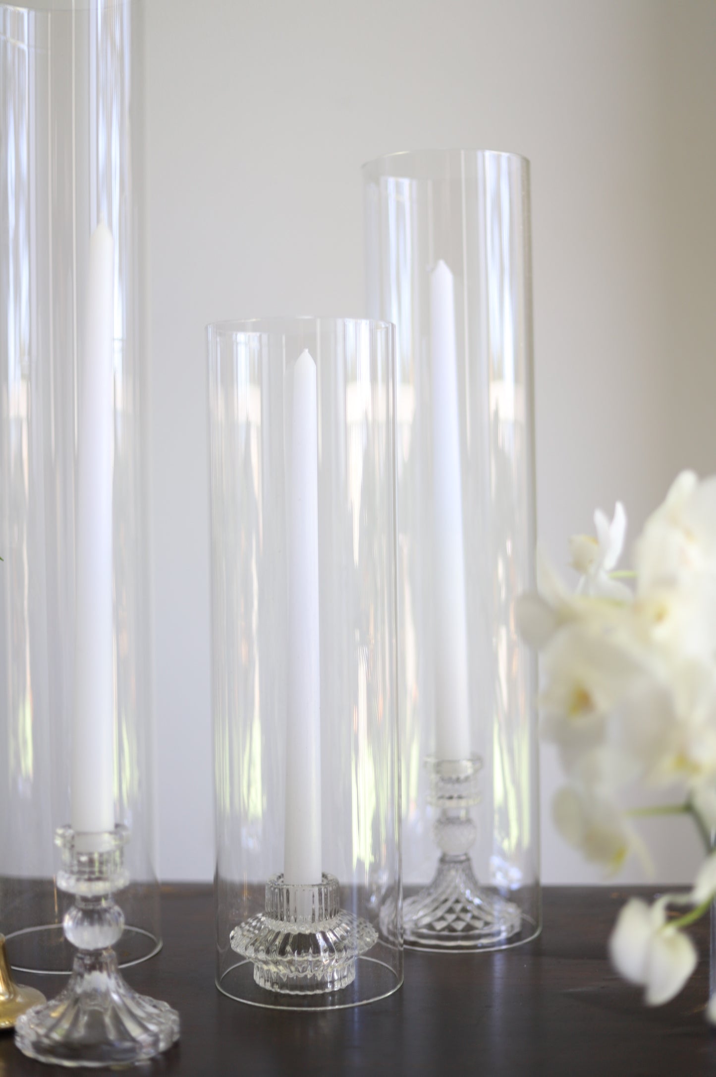 White taper candle + clear holder