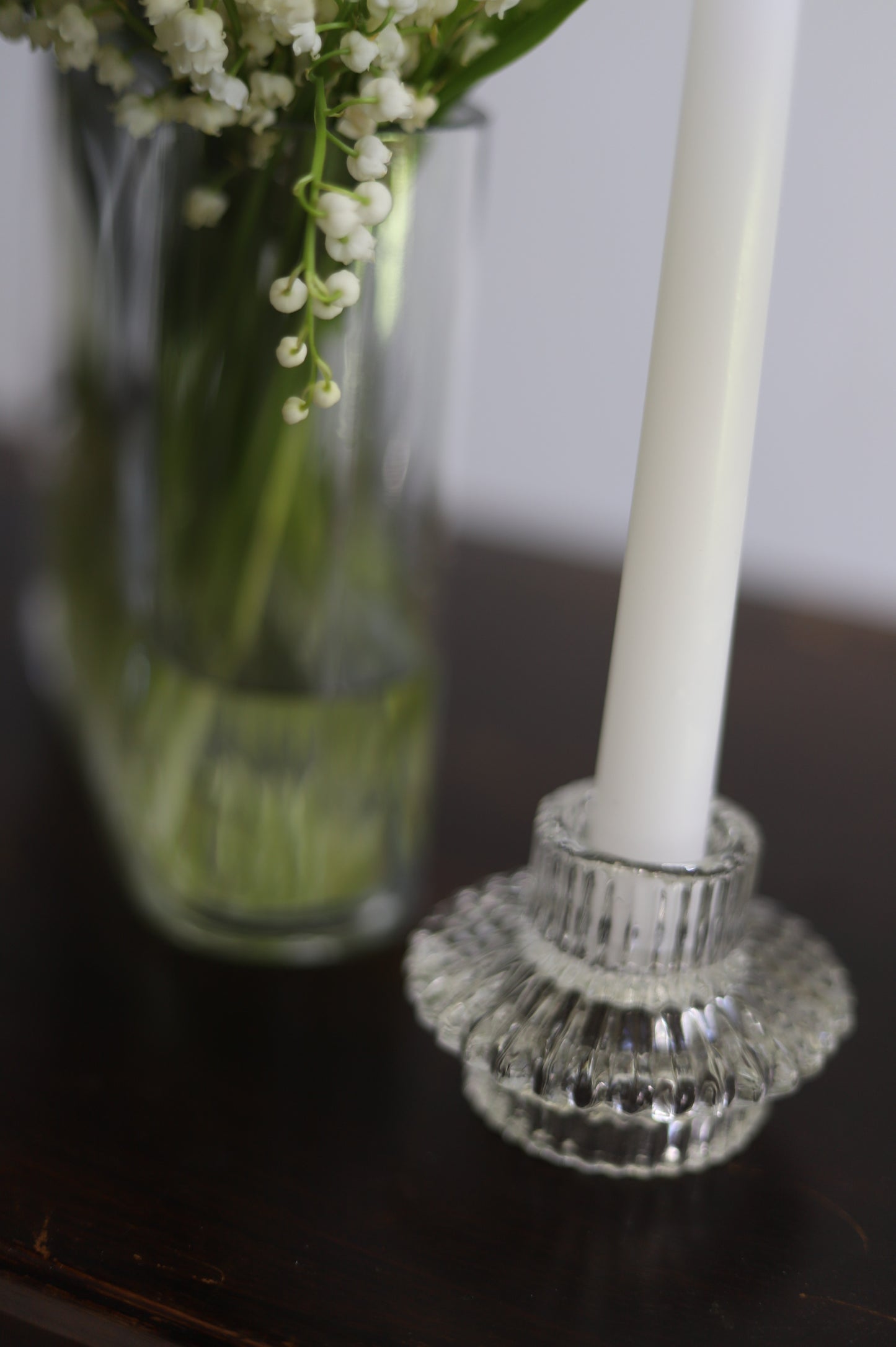 White taper candle + clear holder