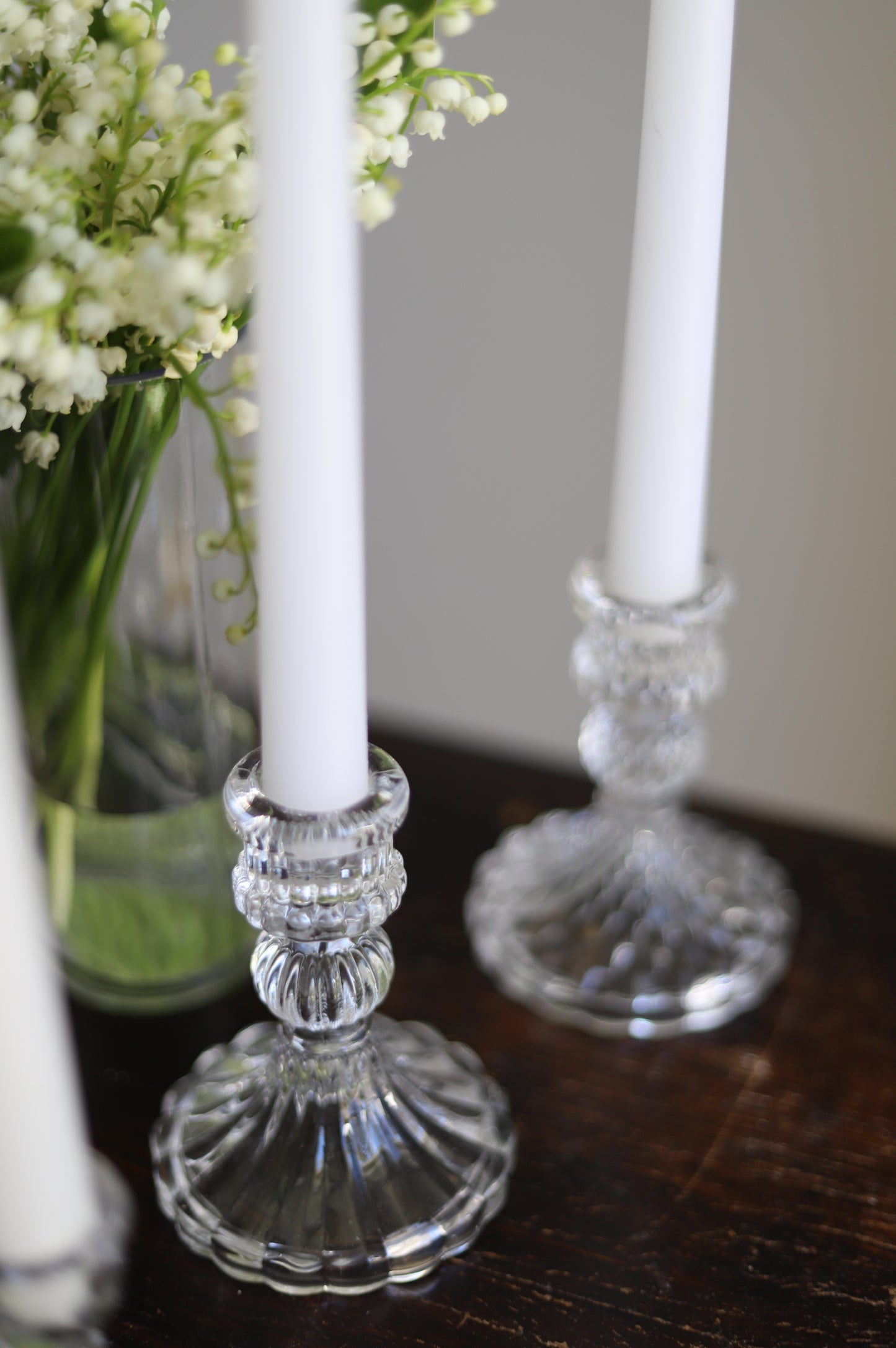 White taper candle + clear holder