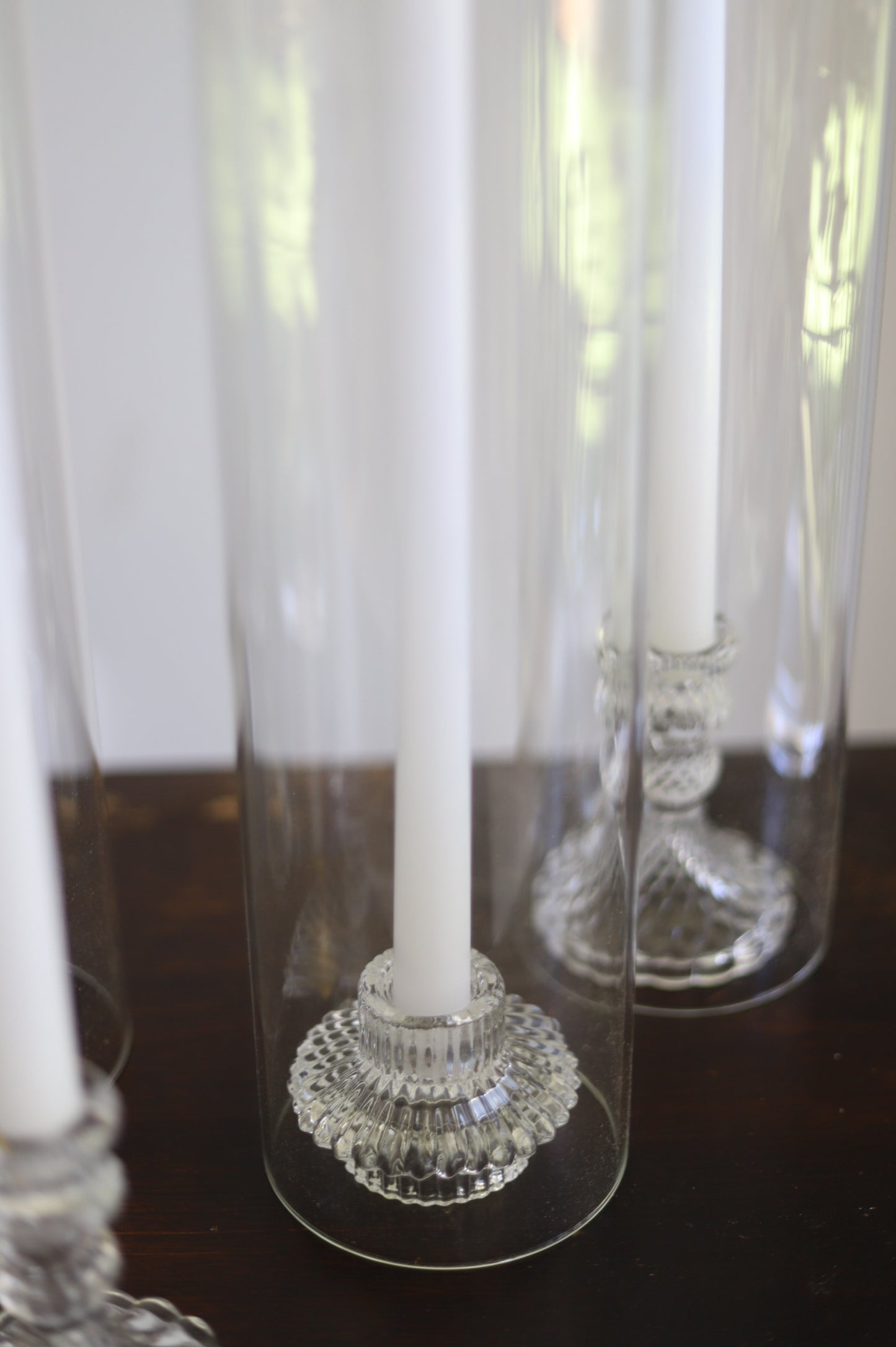 White taper candle + clear holder