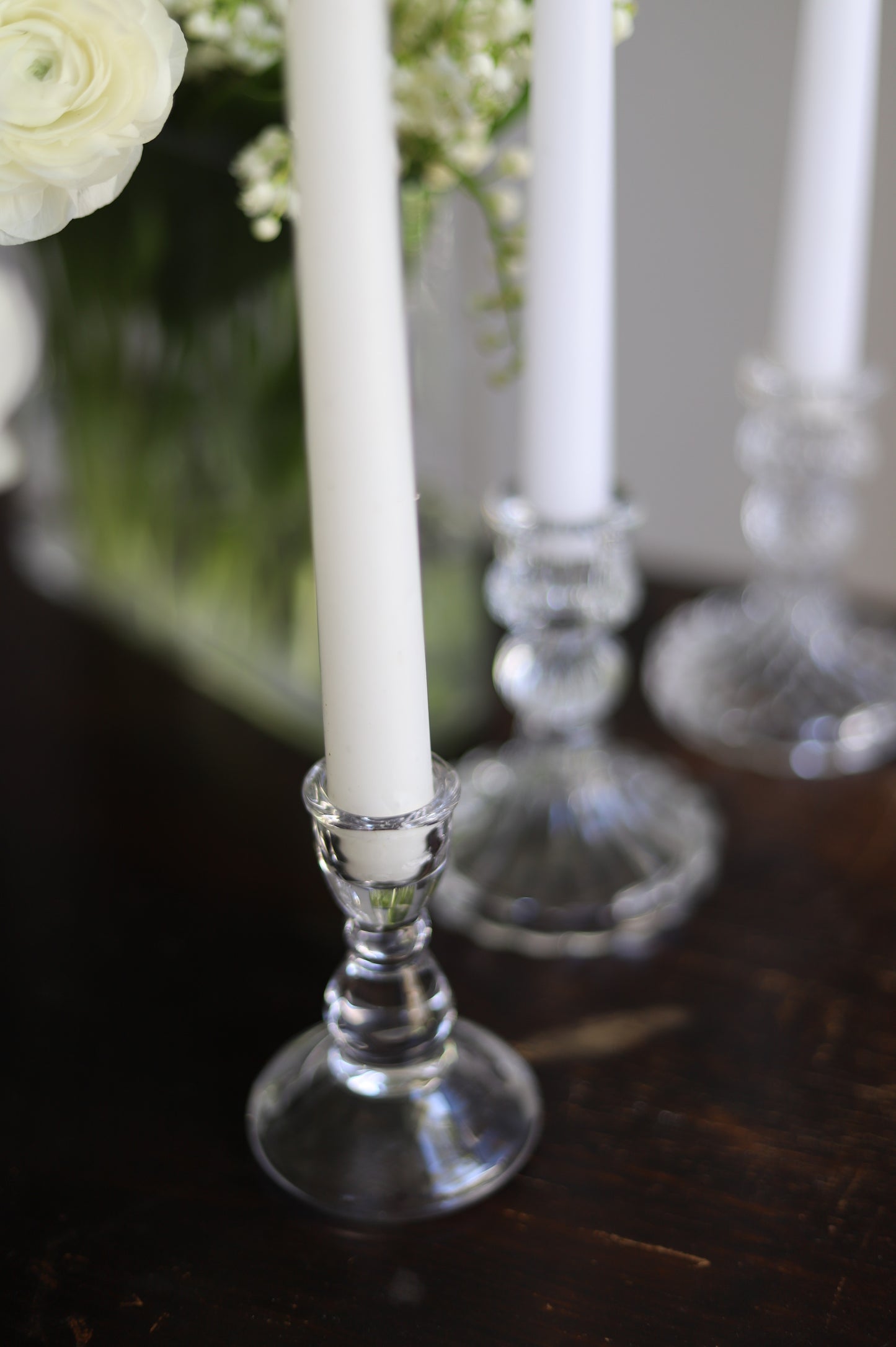 White taper candle + clear holder