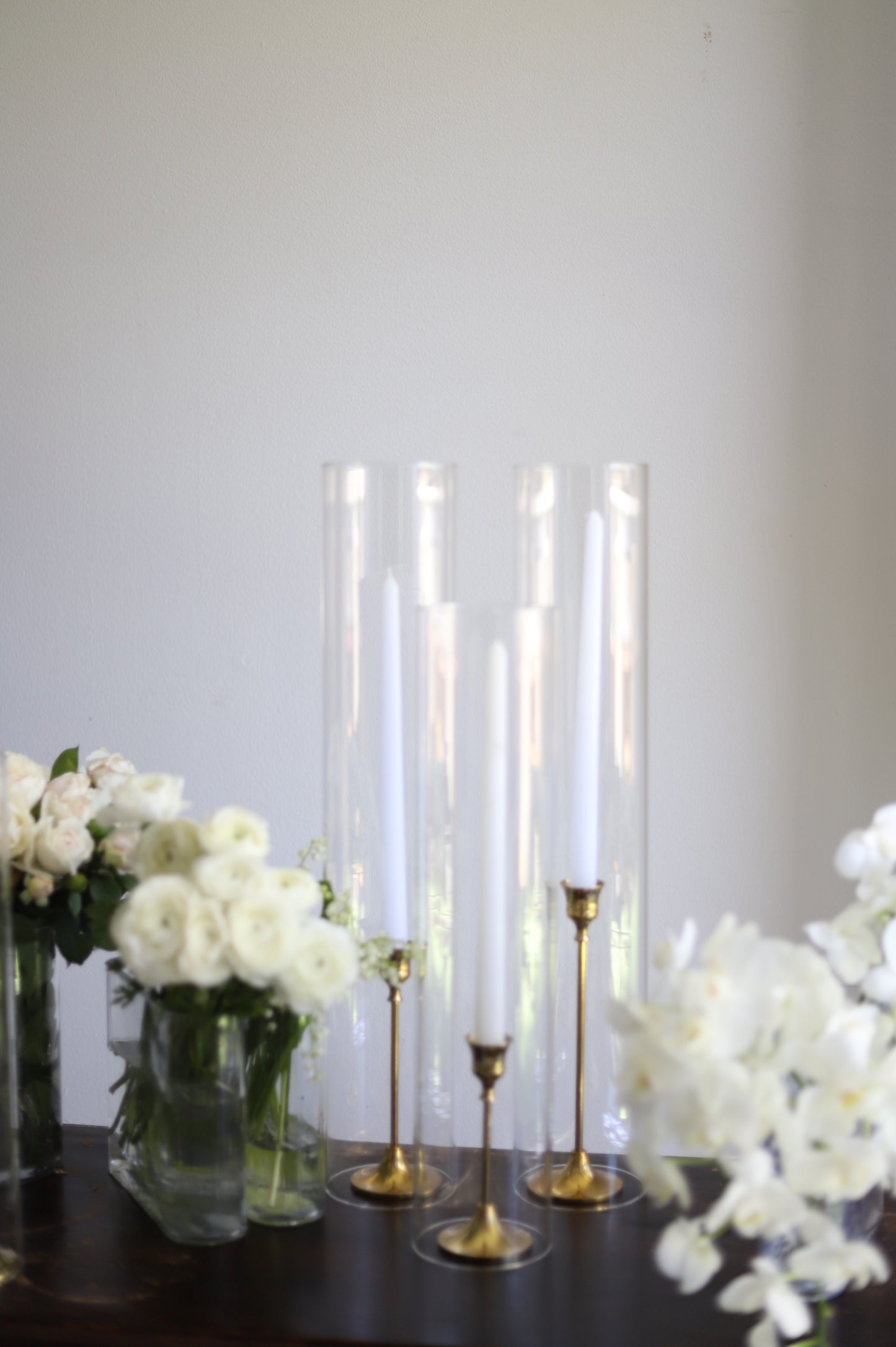 Taper candles in cylinder vase