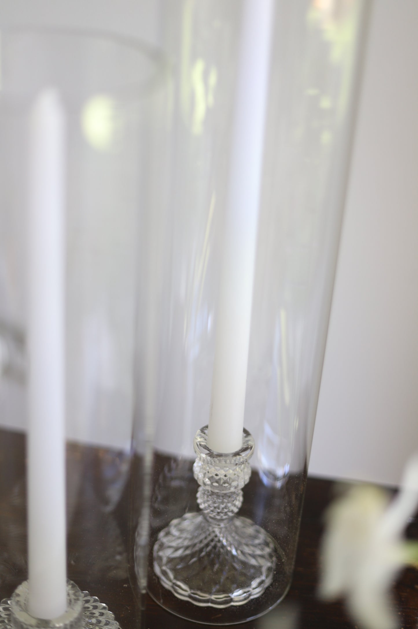 White taper candle + clear holder