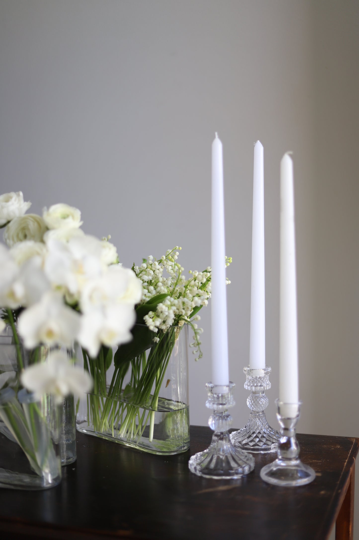 White taper candle + clear holder